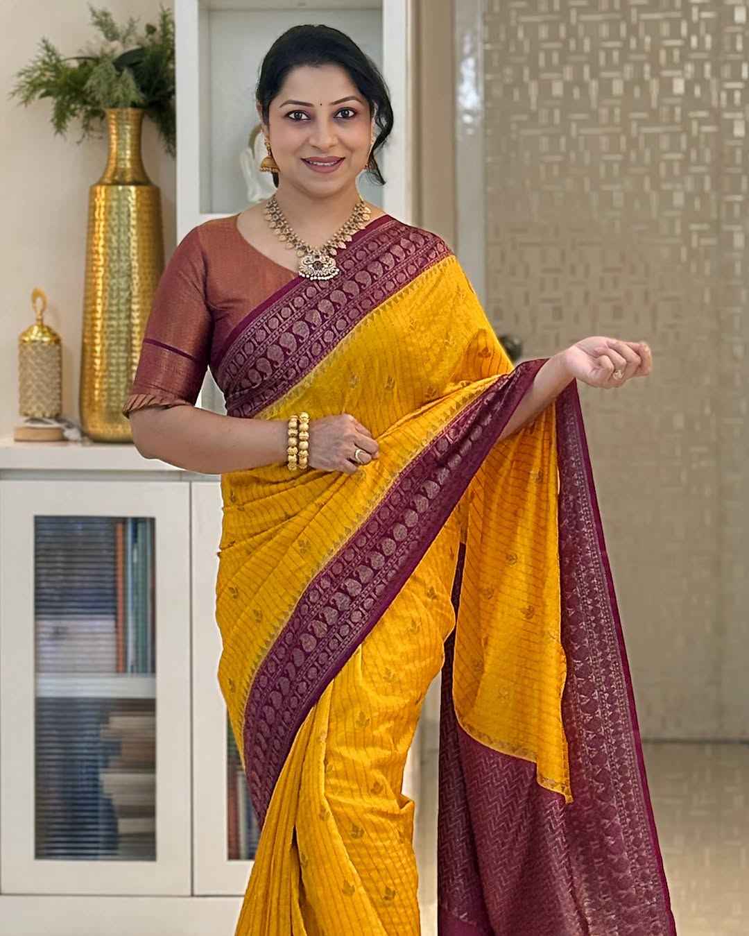 Adorning Yellow Soft Silk Saree With Unique Blouse Piece