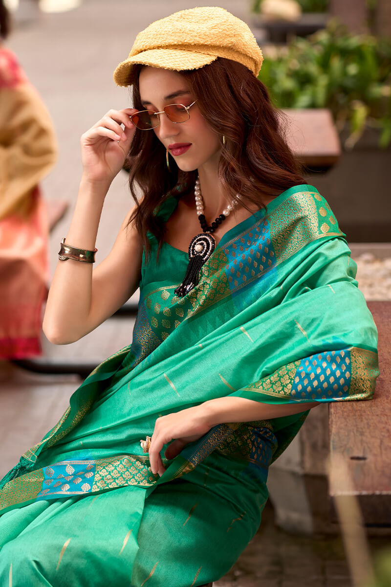 Capricious Sea Green Soft Banarasi Silk Saree With Charming Blouse Piece - Surats Fabric