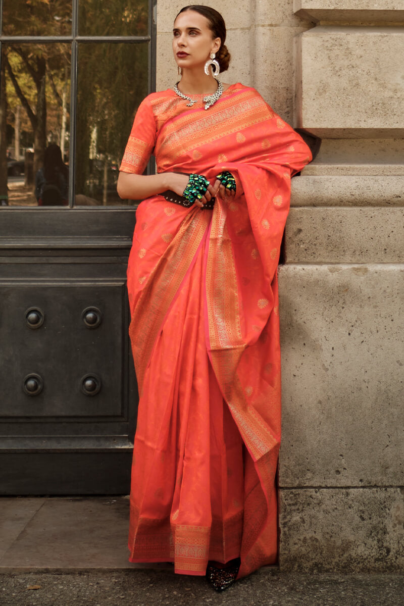 Appealing Orange Soft Banarasi Silk Saree With Groovy Blouse Piece - Surats Fabric